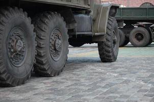 Close up of green military truck. Modern military transportation vehicle technologies photo