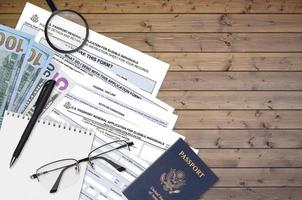 Department of State form DS82 U.S. Passport renewal application for eligible individuals lies on table and ready to fill. Paperwork during operations with US Passport concept photo