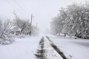 KHARKIV. UKRAINE - APRIL 4, 2017 Unexpected rapid fallout of snow in April on the Kharkov streets photo