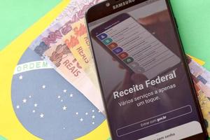 TERNOPIL, UKRAINE - MAY 20, 2022 Brazilian Receita Federal smartphone app. Receita Federal is the Brazilian federal revenue service agency and a secretariat of the Ministry of Economy photo