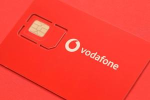 TERNOPIL, UKRAINE - JULY 5, 2022 Vodafone Power SIM mobile card by Vodafone group plc - British multinational telecommunications company who operates networks in 22 countries photo