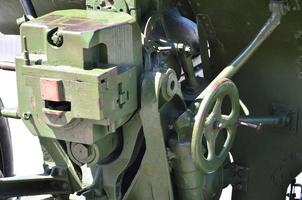 A close-up mechanism of a portable weapon of the Soviet Union of World War II, painted in a dark green color photo