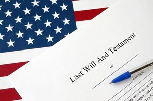 Last Will and testament blank document with pen on United States flag photo