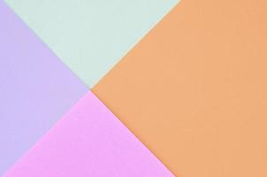 Texture background of fashion pastel colors. Pink, violet, orange and blue geometric pattern papers. photo