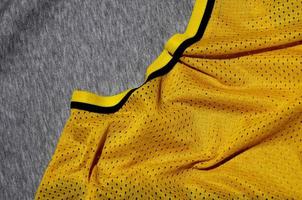 Top view of cloth textile surface. Close-up rumpled heater and knitted fabric texture with a thin striped pattern. Sport clothing fabric texture. Colored basketball shirt and heater hoodie photo