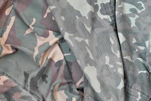 Camouflage background texture as backdrop for army and military design projects photo