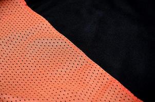 Close up of red polyester nylon sportswear shorts to created a textured background photo
