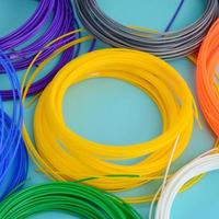 Plastic PLA and ABS filament material for printing on a 3D pen or printer of various colors photo