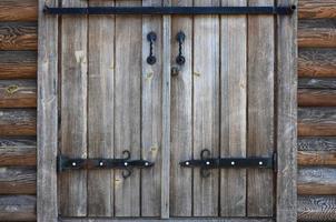 The texture of an antique wooden door from the 16th and 17th century photo