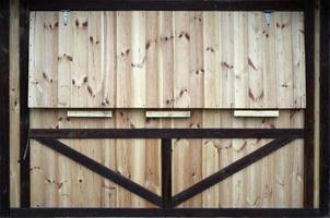 Wooden background. Texture of a wooden wall with dark and light planks. Unpainted board photo