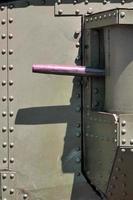 The texture of the wall of the tank, made of metal and reinforced with a multitude of bolts and rivets. Images of the covering of a combat vehicle from the Second World War with a guided machine gun photo