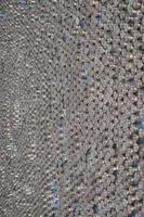 Pattern of 12 gauge cartridges for shotgun bullets. Shells for hunting rifle close up. Backdrop for shooting range or ammunition trade concepts photo