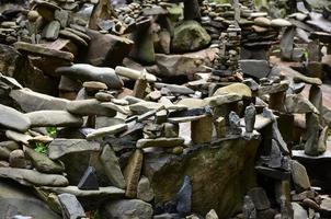 A strange composition of small mountain rocks. imitation of ancient buildings on a reduced scale photo