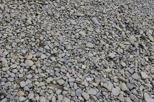Texture of many crushed stones. Crushed stone is a solid base material for foundation photo