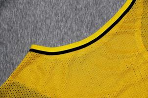 Top view of cloth textile surface. Close-up rumpled heater and knitted fabric texture with a thin striped pattern. Sport clothing fabric texture. Colored basketball shirt and heater hoodie photo