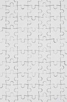Close up texture of a white jigsaw puzzle in assembled condition. Top view. Many components of a large whole mosaic are united photo