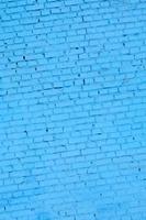 Square brick block wall background and texture. Painted in blue photo