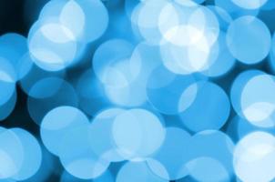 Blue Festive Christmas elegant abstract background with many bokeh lights. Defocused artistic image photo