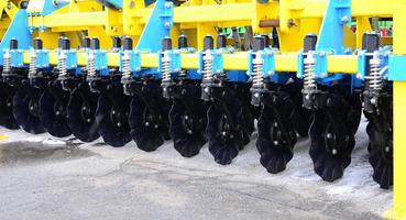 Spring system of agricultural seeder close up photo