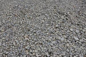 Texture of many crushed stones. Crushed stone is a solid base material for foundation photo
