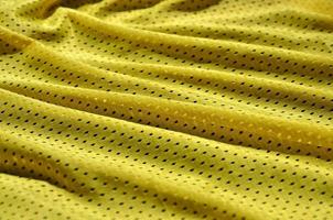 Texture of sportswear made of polyester fiber. Outerwear for sports training has a mesh texture of stretchable nylon fabric photo