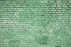 Square brick block wall background and texture. Painted in green photo