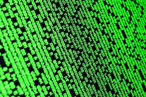 Macro of password selection on the monitor of the office computer. The concept of hacking the protection of a personal data keeper. The stream of supposed digital passwords of four and five digits photo