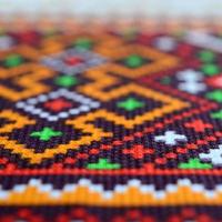 Traditional Ukrainian folk art knitted embroidery pattern on textile fabric photo