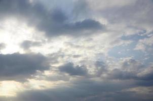 Blue sky with many white clouds. Cloudly weather summer background photo