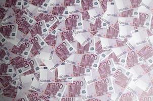 Close up background photo Amount of Five hundred notes of European Union Currency. Many pink 500 euro banknotes are adjacent. Symbolic texture photo for wealth