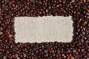 Texture of a gray canvas made of old and coarse burlap with coff photo