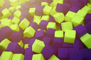 Many colorful soft blocks in a kids' ballpit at a playground photo