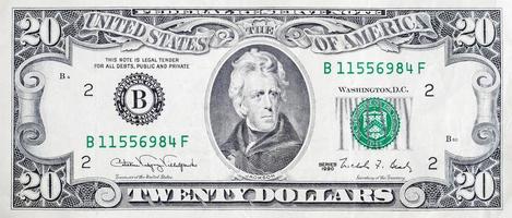 Portrait of US president Andrew Jackson on 20 dollars banknote closeup macro fragment photo