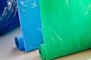 Multicolored colored bright motley rolls of plastic film. Chemical production, high-pressure polyethylene photo