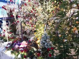 A festively decorated Christmas tree with bows, balls and garlands photo