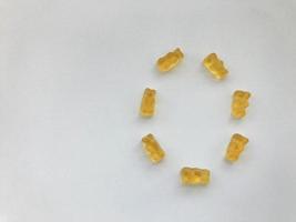 creative edible letter O made from gummy bears. The letter is made from yellow gelatinous and tasty candies. high-calorie dessert, delicious creative alphabet. word study photo