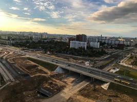 car junction on the road. large intersection, long bridge to redirect traffic flows. new road junction in the city center. construction of roads with improved surface photo