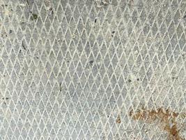 superficie de metal oxidado de hierro industrial con fondo antideslizante de rombos, textura foto
