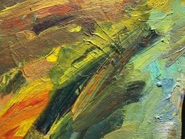 green-yellow texture. application of yellow and green paint on canvas. creative drawing. the texture is heterogeneous, voluminous. waves of paint on canvas. the background photo