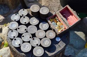 Craft mold presses for blacksmith coinage. Round metal molds for making iron money coins photo