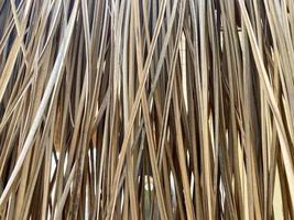 Background, texture of natural dry yellow straw for the roof photo