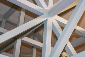 The texture of white wooden strong beams, log and ceilings under the ceiling. The background photo