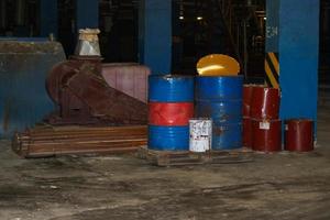 Barrels of oil and fuel, lubricating materials in a dark warehouse at the industrial refinery chemical petrochemical photo