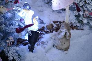 Winter background with squirrel decor and garland lights photo