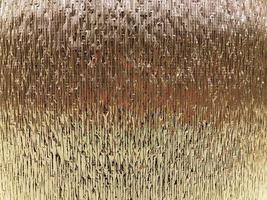 Texture of beautiful yellow gold silver shiny foil for heat insulation. The background photo