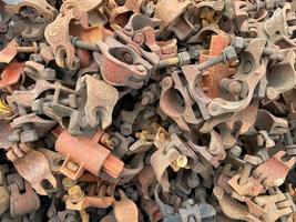 Industrial iron rusty metal clamps clamps hardware fasteners for chemical industry or construction. Background, texture photo