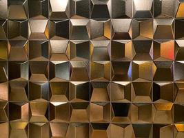 Beautiful golden carved convex shiny squares. Background, texture photo