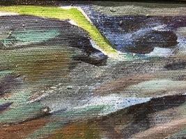 acrylic hard hat applied to canvas. texture in gray, green colors. geometric image. heterogeneous, colored, stylish texture. aged rough surface in dark colors photo