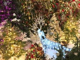 Fragment Of A Decorated Christmas Trees And Gifts To Children photo