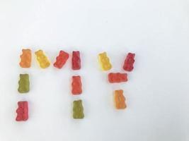 gelatinous, multi-colored, voluminous bears in the form of the word MY. appetizing, sweet, edible candy lettering. favorite gummy treats. vitamin natural candies photo